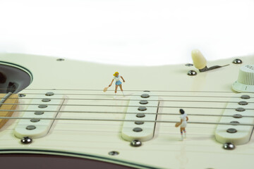 two women tennis players play a tennis match on an electric guitar