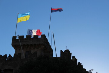 Cagnes sur Mer, France - February 28, 2022:  Flags of France and Cagnes sur Mer flown with the Ukrainian flag in solidarity against the Russian invasion