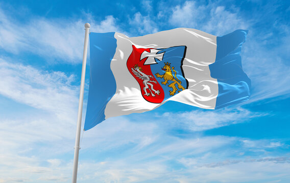 flag of Subcarpathian Voivodeship, wojewodztwo podkarpackie , Poland at cloudy sky background on sunset, panoramic view. Polish travel and patriot concept. copy space for wide banner