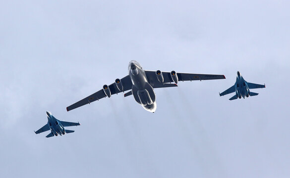 Kyiv, Ukraine - August 24, 2021: Ukrainian Air Force Ilyushin Il-76 Candid (in Center) and two Su-27 Flanker planes in the sky over Kyiv during the Ukraine Independence Day Parade