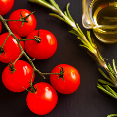 Cooking concept with tomatoes, rosemary and olive oil. Top view