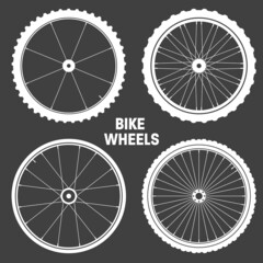 White bicycle wheel symbols collection. Bike rubber tyre silhouettes. Fitness cycle, road and mountain bike. Vector illustration.