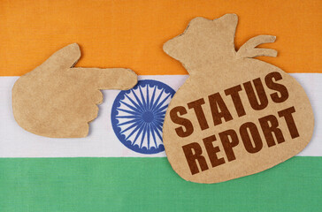 On the flag of India, cardboard figures of a hand and a money bag with the inscription -