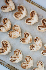 buns in the form of hearts on a baking sheet homemade