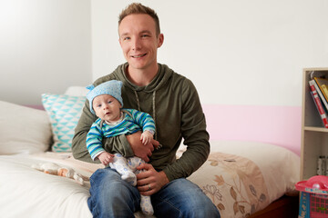 Being a dad is such a heart-warming feeling. Portrait of a father bonding with his baby boy at home.