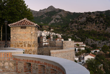 Fototapeta na wymiar Panoramic view of the beautiful andalusian white town of Grazalema among mountains from El Tajo viewpoint at sunrise, Cadiz, Andalusia, Spain