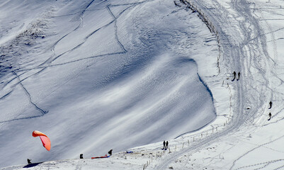 paragliding in a snow landscape