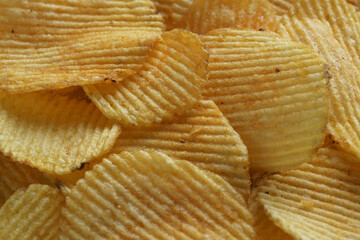 food background with fluted potato chips close-up