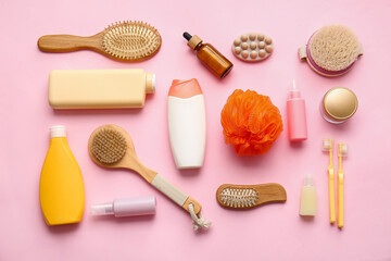 Fototapeta na wymiar Composition with cosmetic products and bath supplies on pink background