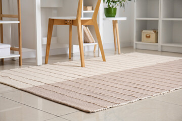 Stylish carpet on tile floor in light room