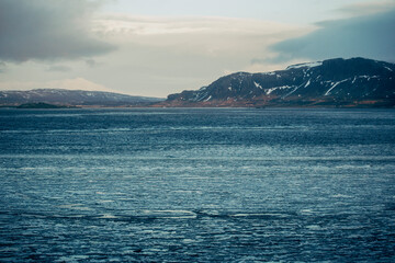 view of the frozen sea and mountains