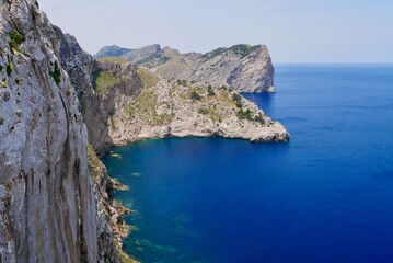 Panoramic view of high cliffs and deep blue sea at Cap de Formentor. Majorca, Spain.