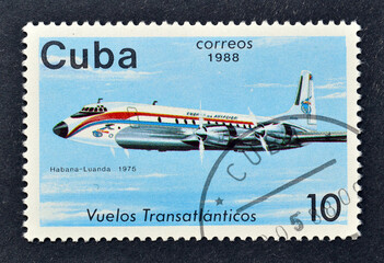 Cancelled postage stamp printed by Cuba, that shows Airplane Douglas DC-7 (1975), Habana - Luanda transatlantic flight, 1975  circa 1988.