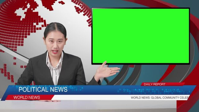 Live News Studio With Asian Professional Female Anchor And Green Screen Television Pointing To Side While Reporting On The Events Of The Day
