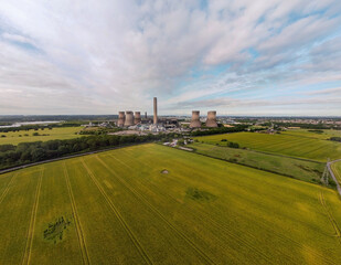 Aerial view of Fiddlers Ferry power station cooling towers across agricultural farmland