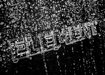 Abstract black and white high contrast photo of water droplets (rain) running over an element emblem