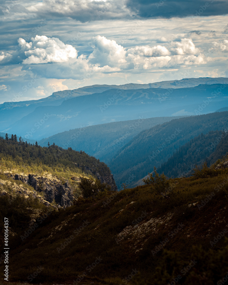 Poster natural view of a mountain landscape under a cloudy sky