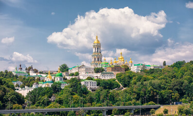 Kyiv Pechersk Lavra in summer. Lavra Belltower, green park and Monastic Buildings, Kyiv. Ukraine