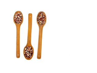 Chenopodium quinoa - Mix of red, white and brown quinoa in three spoons