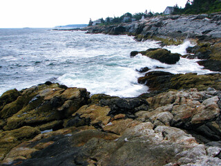 Fototapeta na wymiar crashing waves on rock coastline