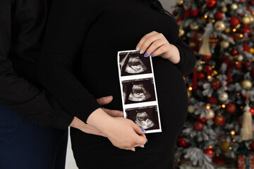 woman holding a pregnancy scan