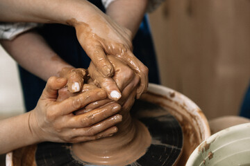 hands of a potter at work