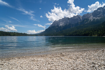 Scenic view of a lake near an alpine mountain - Powered by Adobe