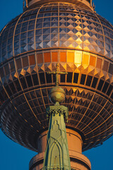 Vertical shot of Berliner Fernsehturm or Fernsehturm Berlin. Berlin Television Tower dome. © Nicolai Duda/Wirestock