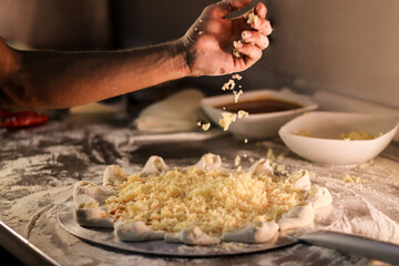 person preparing pizza