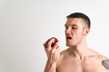 Man holds apples in fitness white background isolated athletic isolated body, muscular diet food muscle shirtless, caucasian hold vegetarian, holding chest