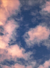 clouds in the sky with stars