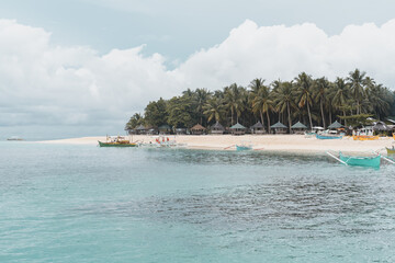 Beautiful view of sandy beach with palm trees in Cebu, Bantayan