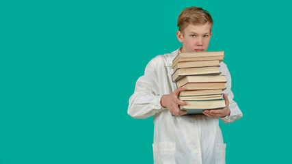 an intern guy with a stack of books on a blue background