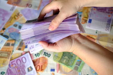 close-up of female hands count paper 500 euro banknotes of the european union, paper banknotes on the table, concept of cash, payments, savings, banking, credit - obrazy, fototapety, plakaty