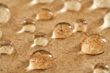super macro of water drops on a wooden surface