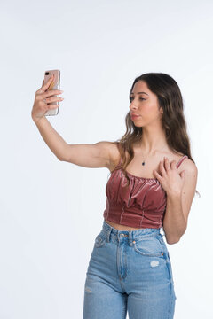 young girl taking a selfie with her smartphone