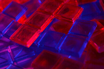 Red and Blue Plastic Pieces on a Grid | Plastic Tiles | Plastic Pieces | Red and Blue Lighting