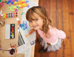She loves to get crafty. Shot of an adorable little girl doing arts and crafts.