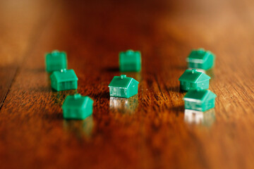 Toy houses isolated with the wood background. selective focus
