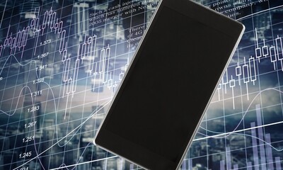 Cryptocurrency exchange. A smartphone with a blank screen on the background of the live trading...