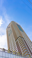 Fototapeta premium Exterior of high-rise condominium and refreshing blue sky scenery_w_31