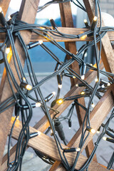 Closeup shot of twinkle lights on a wooden structure