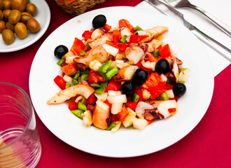 Delicious cold salad from variety of seafood with chopped vegetables (Salpicon de mariscos) typical for Spanish cuisine