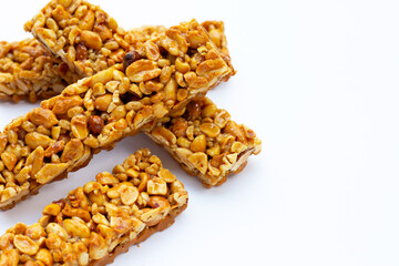 Peanut bar with almonds on white