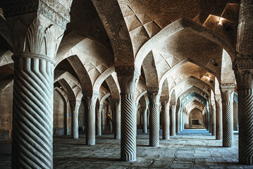 Interior with columns and pointed arches in Vakil Mosque in Shiraz, Iran