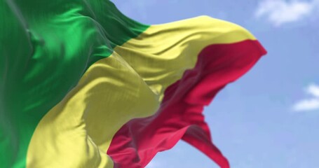 Detail of the national flag of Congo Republic waving in the wind on a clear