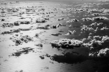 Beautiful clouds over the Atlantic ocean. Artistic black and white image.