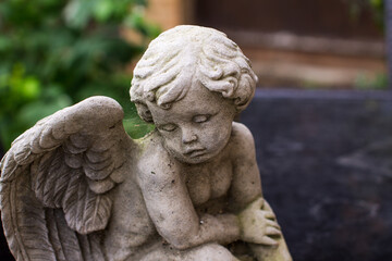 Selective focus shot of a stone angel statue