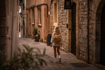 Closeup of a girl walking down a narrow street