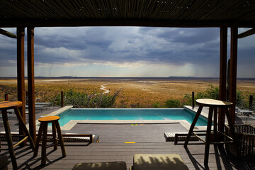 Beautiful tranquil scenery of swimming pool with the view of Etosha National Park